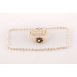 A four-row cultured pearl bracelet and a single-row pearl necklace; the bracelet comprises four rows