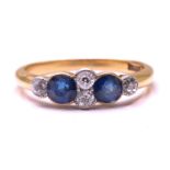 A sapphire and diamond half hoop ring in 18ct gold, contains two round sapphires flanked by four
