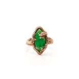 A Chinese dragon ring set with green jade, featuring a jadeite marquise cabochon in patchy chrome