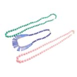 A lapis lazuli fringe bib necklace and two other beaded necklaces; The fringe bib necklace comprises