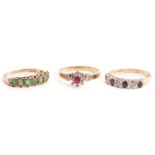 Three gem-set rings in 9ct yellow gold; to include an emerald half eternity ring to tapered flat
