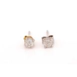 A pair of diamond stud earrings in 18ct white gold, each comprising a 4.5 mm brilliant-cut diamond