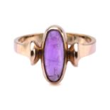 An amethyst ring in 9ct gold, comprises an elongated oval amethyst cabochon, collet set in mount