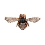 A gem-set bee brooch, with ruby set eyes and a sapphire cabochon thorax, rose-cut diamonds and