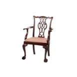 A Chippendale-style mahogany ribbon back open armchair, early 20th century; with shaped and olive