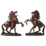 After Guillaume Coustou, a pair of French bronze models of the Marly Horses, unsigned, 44 cm high (