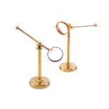 Two lacquered brass bullseye condenser lenses, each with 1¾ inch lens and adjustable arms and