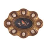 A 19th century engraved gilt-metal dish with scalloped edge mounted with cameos and pietra dura oval