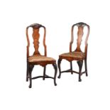 A pair of late 18th century Dutch marquetry inlaid walnut side chairs with carved shell cresting