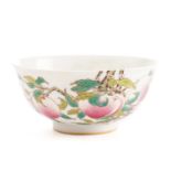 A Chinese porcelain bowl, painted throughout with peaches, blossom and red bats, apocryphal four