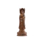 A Chinese bronze figure of the Guanyin of Nanshan, the standing figure dressed in loose robes and