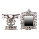 An impressive white-painted and carved composition Baroque console table and wall mirror with a
