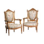 A pair of Louis XVI-style carved wood and gilt gesso fauteuils a la Reine (armchairs) probably