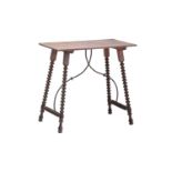 A late 19th-century Italian/ Spanish walnut and birch rustic side table, with a simple one-piece top