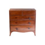 A George III mahogany caddy topped chest of two short over three long drawers with satinwood