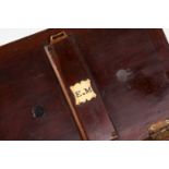 A George III style mahogany tea caddy, with three compartments, containing chess pieces, 27 cm wide,