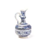 A Chinese porcelain blue and white ewer, of Persian influence, painted with bands of lotus flowers
