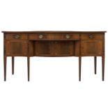 A Friedman Brothers 1929; a George III style inlaid mahogany, serpentine kneehole sideboard with