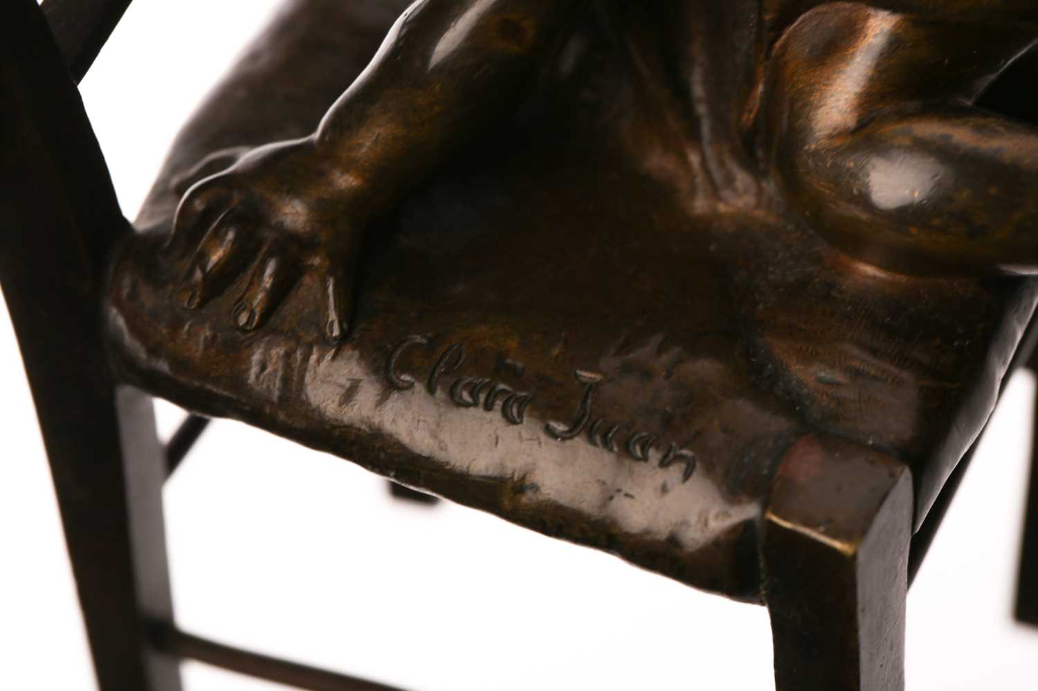 After Juan Clara, a bronze figure of a girl seated on a stool putting on a shoe, signed and numbered - Image 9 of 11