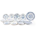 A collection of Chinese export blue & white porcelain plates, Qing, 18th century, comprising a large