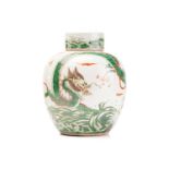 A Chinese porcelain Famille verte ginger jar & cover, painted with a dragon amongst fiery clouds