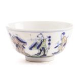 A Chinese porcelain wucai bowl, painted with the eight immortals, above a band of waves,