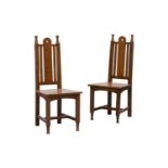 A pair of oak Arts & Crafts hall chairs with arched and pierced solid straight-through splat and