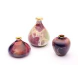 Three Wilkinsons ‘Oriflame’ miniature vases, in various mauve, green and deep purple glazes, black