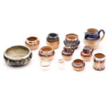 A collection of Doulton stoneware Harvest ware miniatures, mostly with silver or plated rims,