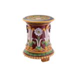 A Minton majolica garden seat, late 19th century, of cylindrical shape decorated in high relief with