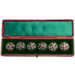 A cased set of six silver buttons, London 1904 by Samuel Jacob, pierced foliate design, in a