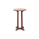 A late 19th/ early 20th-century Cotswold school octagonal rosewood pedestal table supported by