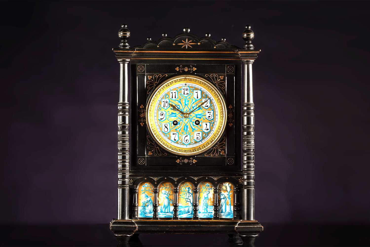 An Aesthetic Movement period 8-day mantle clock, with an ebonized architectural case with engraved