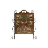 An Arts & Crafts beaten copper and wrought iron firescreen in the manner of J.S. Sankey of