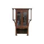Possibly Maple & Co for Liberty, an oak Arts & Crafts "Judge Not A Book By The Cover" bookcase,