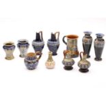 A collection of eleven Doulton stoneware small vases and pitchers, four being pairs, and a small