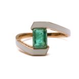 An emerald and enamel bypass ring, consisting of an emerald-cut green emerald of 6.4 x 4.7 mm, in