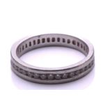 A full hoop diamond eternity ring, the round brilliant cut diamonds channel mounted within a