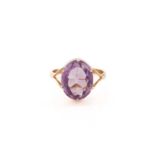 An amethyst ring, consisting of an oval-cut amethyst approximately measures 14.5 x 11.2 mm, claw