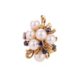 A dress ring with cultured pearls and sapphires, emanating with six cultured pearls in a yellow