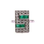 An Art Deco emerald and diamond panel ring, the slightly curved rectangular panel is pavé-set with