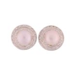 A pair of pearl and diamond earrings; each comprises a round button-shaped silver pearl with pink