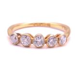 An old-cut diamond 5-stone ring, set with five rub-set with milgrain edge round old cuts with a
