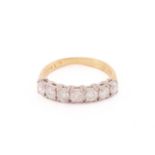 A diamond half eternity ring, comprising seven brilliant-cut diamonds, approximately measuring 3.3 x