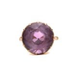 An amethyst dress ring, comprising a round mixed-cut amethyst of size 14.8 mm, mounted in coronet