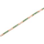 An emerald and diamond line bracelet, comprising slightly curved links channel-set with round