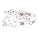 A lot consisting of assorted white metal jewellery, to include a silver open bangle, engraved with