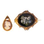 A Victorian micro mosaic brooch and a shell cameo brooch; the first brooch showcases micro mosaic