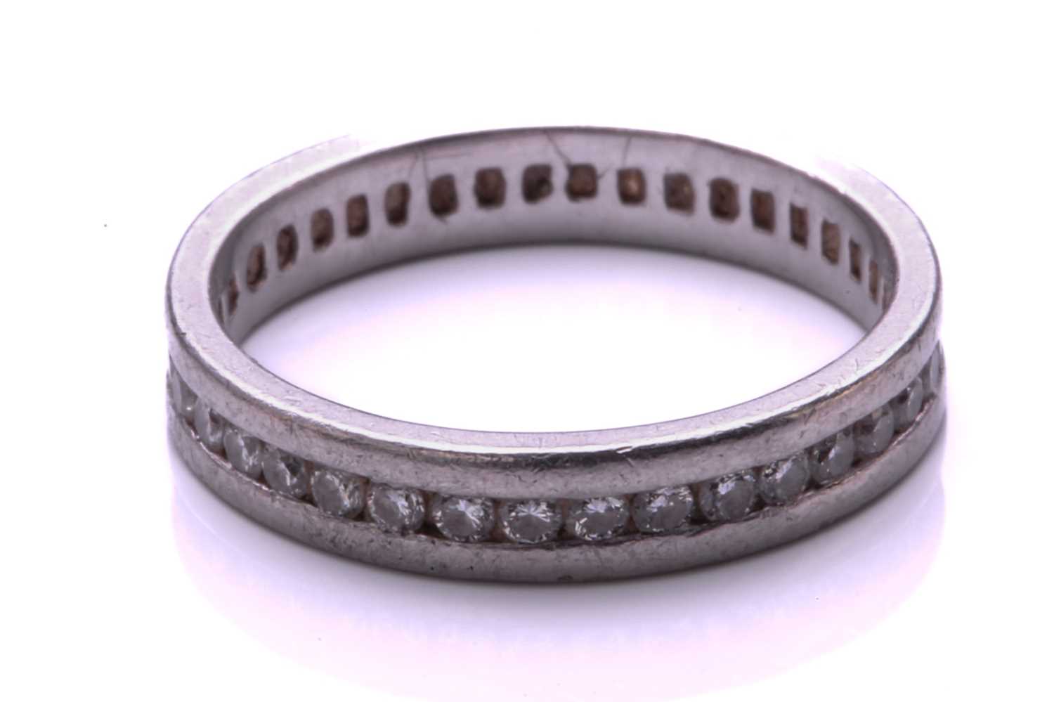 A full hoop diamond eternity ring, the round brilliant cut diamonds channel mounted within a - Image 2 of 3