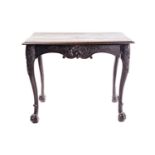 An early 18th-century style carved oak side table with a single frieze drawer with a large shell